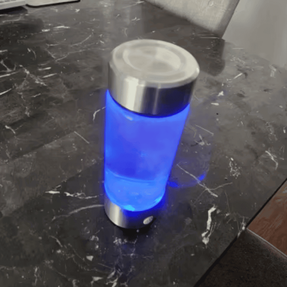 Blue-lit portable device on a dark marble surface