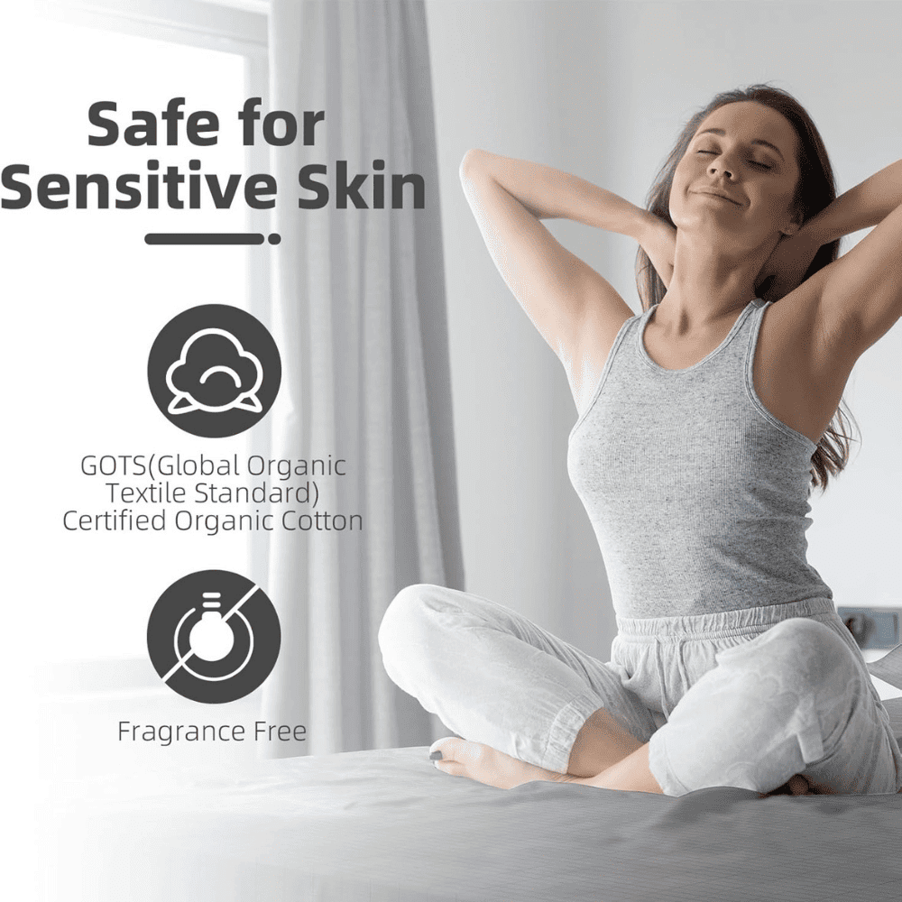 Woman in organic cotton clothing sitting on a bed with safety certification icons displayed.