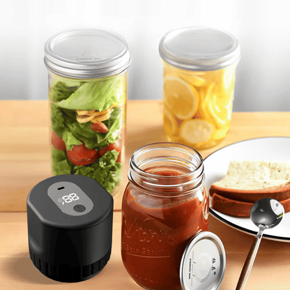 Glass jars with food and a black digital device on a wooden surface